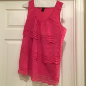 Sleeveless shell with ruffles and eyelets